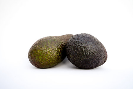 avocados presented on white background
