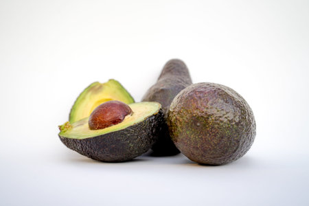 avocados presented on white background