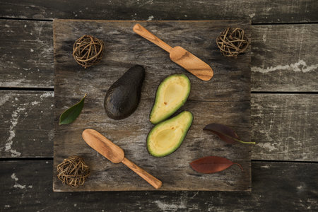 avocado decorated on wood with wooden shovels