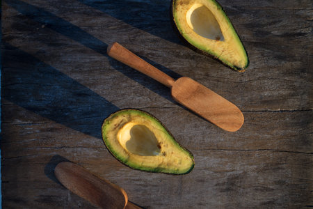 avocado decorated on wood with wooden shovels