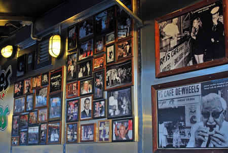 Sydney, Australia - July 11, 2014: Frames with photos of famous guests on the wall at Harry's Cafe de Wheels. Harry's Cafe de Wheels is an iconic pie cart in Woolloomooloo suburb, New South Wales, on Cowper Wharf Road.のeditorial素材