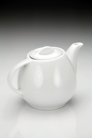 White porcelain teapot for preparation of hot invigorating drink.の写真素材