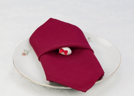 The dish is decorated with a red napkin and easter eggの写真素材