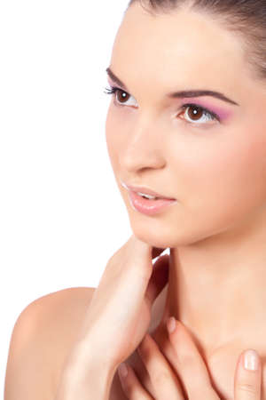 Closeup portrait of a beautiful young woman with big brown eyes, looking sideways. High resolution image taken in studio. Isolated on pure white background with copy space for your ad.の写真素材