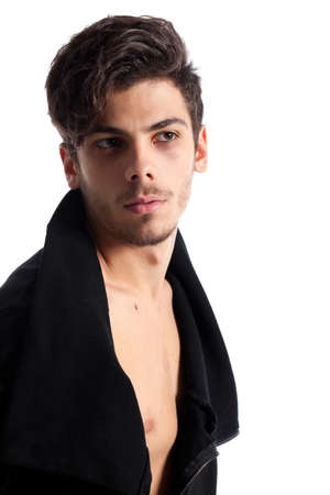 Portrait of a young man with cool hairstyle. Isolated on white background. Studio vertical image.の写真素材