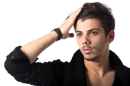 Portrait of a young man with cool hairstyle. Isolated on white background. Studio horizontal image.の写真素材