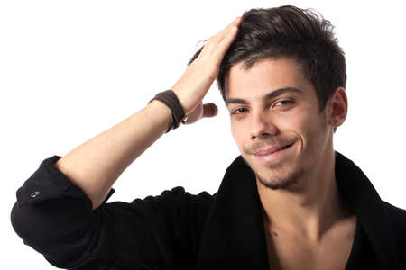 Portrait of a young happy man with cool hairstyle looking at camera. Isolated on white background. Studio horizontal image.の写真素材
