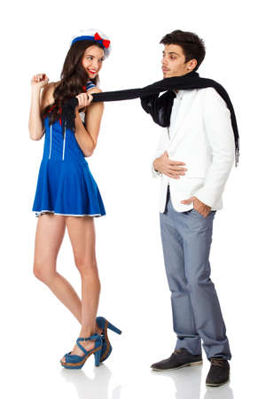 Full body shot of a happy woman flirting with a rich young man. Isolated on white background. High resolution studio imageの写真素材