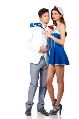 Young sexy couple enjoy roleplay in sailor uniform. Full body shot. Isolated on white background. High resolution studio imageの写真素材