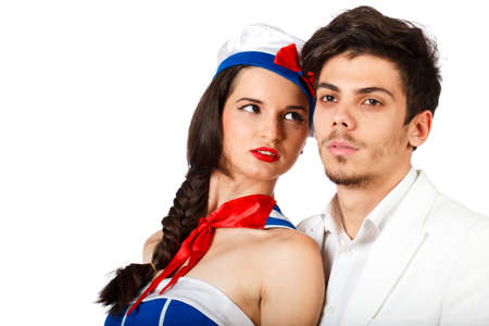 Passionate sexy young couple roleplay sailor and captain. Isolated on white background. High resolution studio imageの写真素材