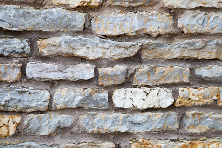 Background of the old natural stone wall.の写真素材