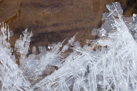 Icicles on a background of the current streamの写真素材