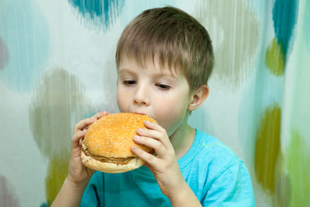 boy with burgerの写真素材