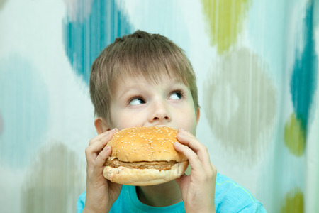 boy with burgerの写真素材