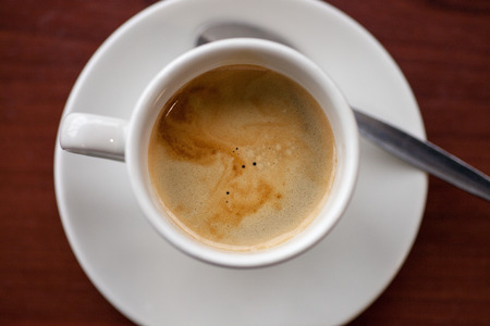 Cup of coffee on a saucerの写真素材