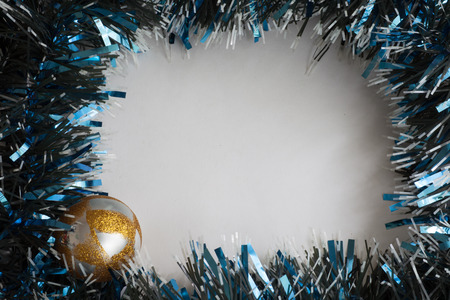 Christmas tinsel decorations on the woodの写真素材