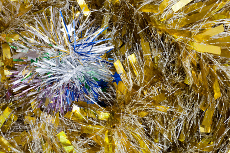 Christmas tinsel decorations on the woodの写真素材