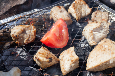 Cooking of a barbecue on a grill closeupの写真素材