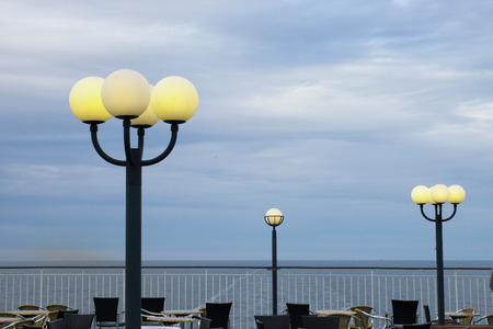 burning lamps against the storm skyの写真素材