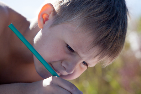 The boy drawing a pencilの写真素材