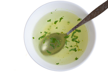 Clear soup in a white cupの写真素材