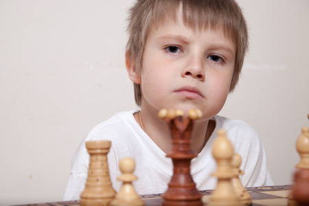 Portrait of a boy playing chessの写真素材