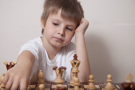 Portrait of a boy playing chessの写真素材