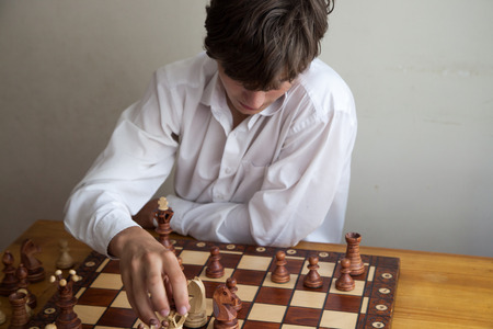 Portrait of a boy playing chessの写真素材