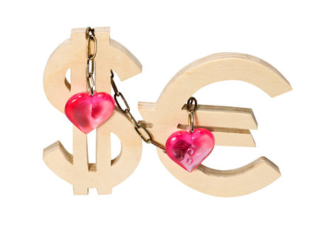 Dollar signs and euro connected by a chain with hearts isolated on a white background