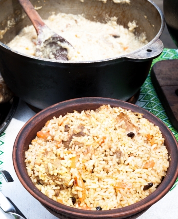 Pilaf with raisins in a bowl on the tableの写真素材