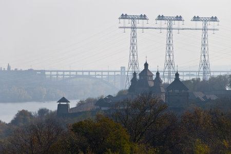 Cossack fortress on the background of modern bridges and electrical towers