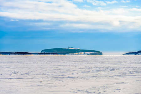 Winter seascape with a lighthouseの写真素材
