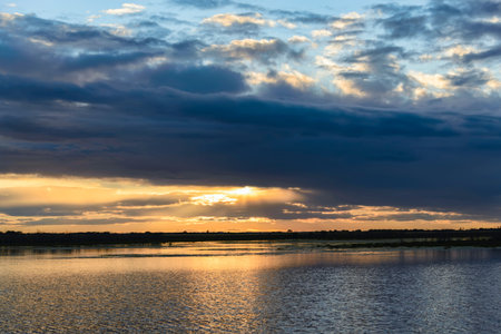 Summer sunset over the river Amur. Summer sunset over the river Amur. The end of September, the last warm days.の写真素材