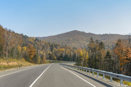 Mountain road on the Far Eastern taiga. Mountain road on a ridge of the Sikhote - Alin, Far East...