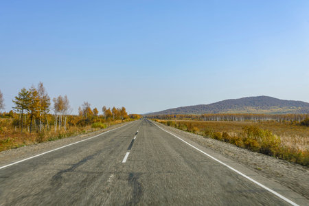 Mountain road on the Far Eastern taiga. Mountain road on a ridge of the Sikhote - Alin, Far East...