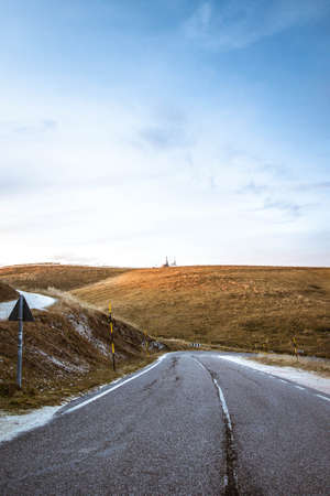 Driving a Car on a Road in italians alpsの写真素材