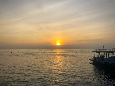 Beautiful ocean sunset and boat. Maldives island, travelの写真素材