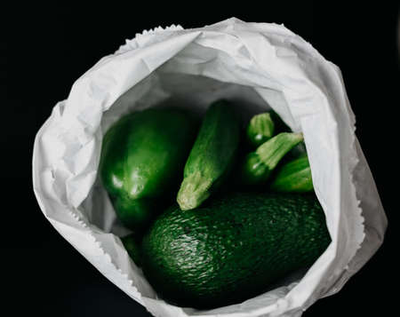 Fresh and juicy green vegetables on a black backgroundの写真素材
