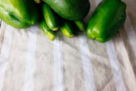 Fresh and juicy green vegetables on a black background
