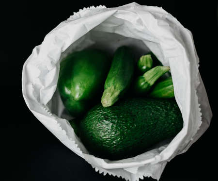 Fresh and juicy green vegetables on a black backgroundの写真素材