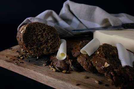Slices of brown bread and butter. Toned image in a retro style.の写真素材