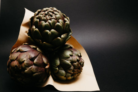Artichoke flower, purple and green edible bud isolatedの写真素材