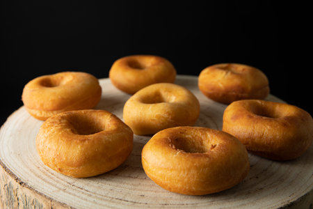 Donuts with caramel and nuts, rustic style, copy spaseの写真素材