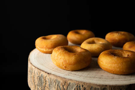 Donuts with caramel and nuts, rustic style, copy spaseの写真素材