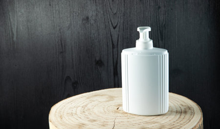 White Natural organic cosmetic packaging plastic mock up on wood table. Mock-up bottle for branding...