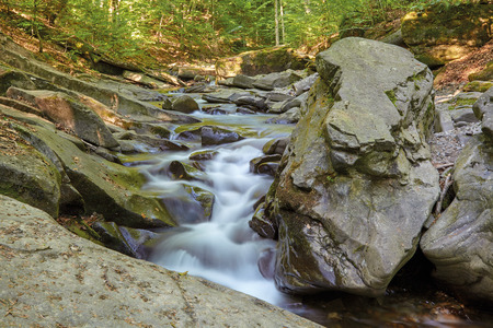 waterfall in the mountainsの写真素材