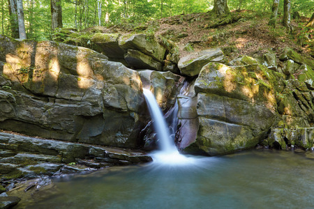 waterfall in the mountainsの写真素材