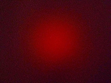 Background with texture of light spots of dark red color.