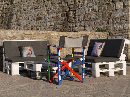 Seats And Table Made Out Of Pallets In stone  wallの写真素材