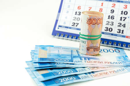 Russian money on the background of the calendarの写真素材